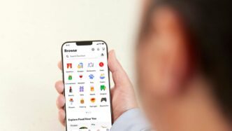 a person holding a cell phone in their hand