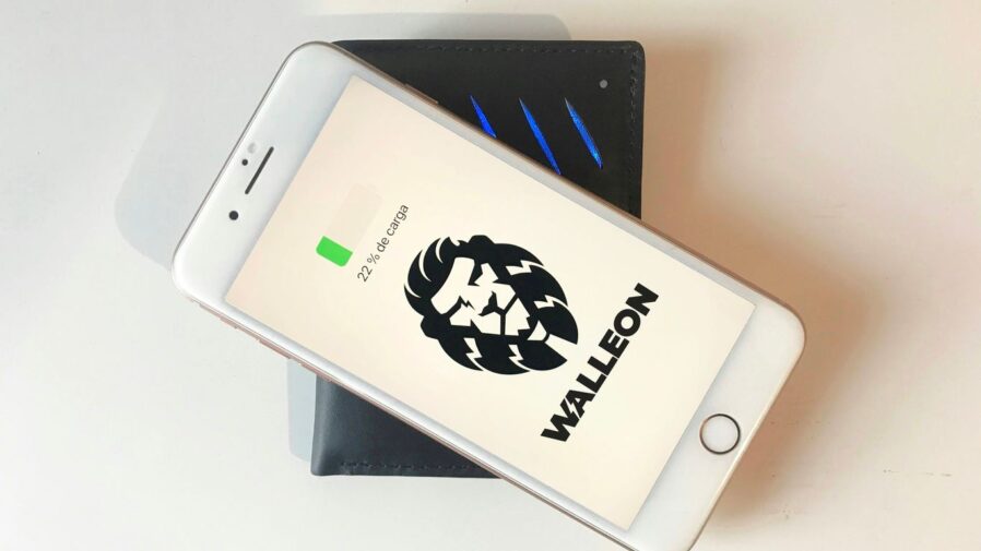 a cell phone sitting on top of a wallet