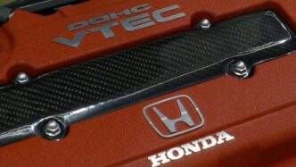 a close up of the hood of a red car