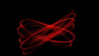 A blurry image of a red object on a black background