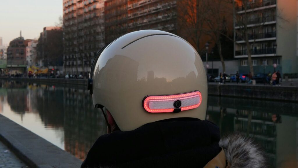 a person wearing a helmet with a red light on it