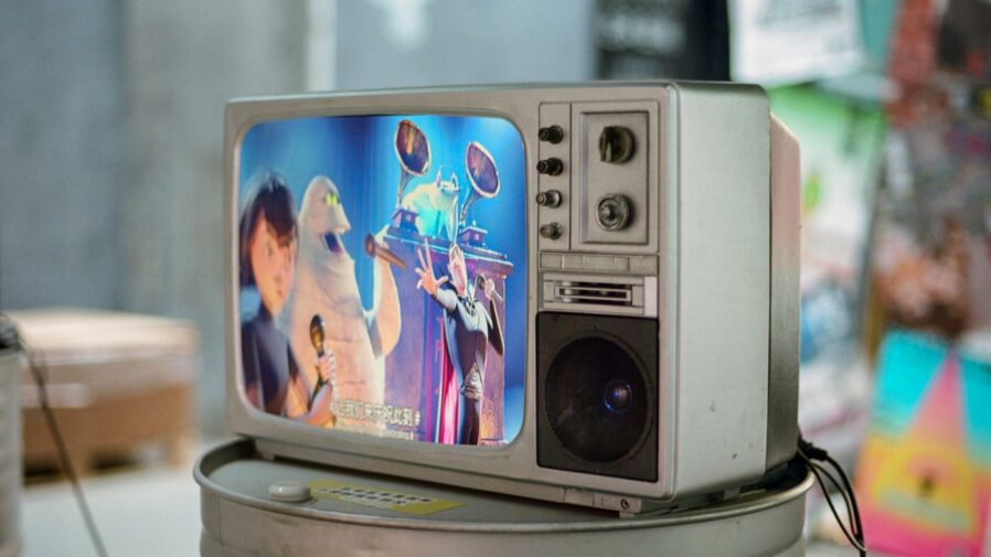A small television sitting on top of a can