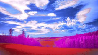 Vibrant, inverted colors illuminate the landscape and sky.