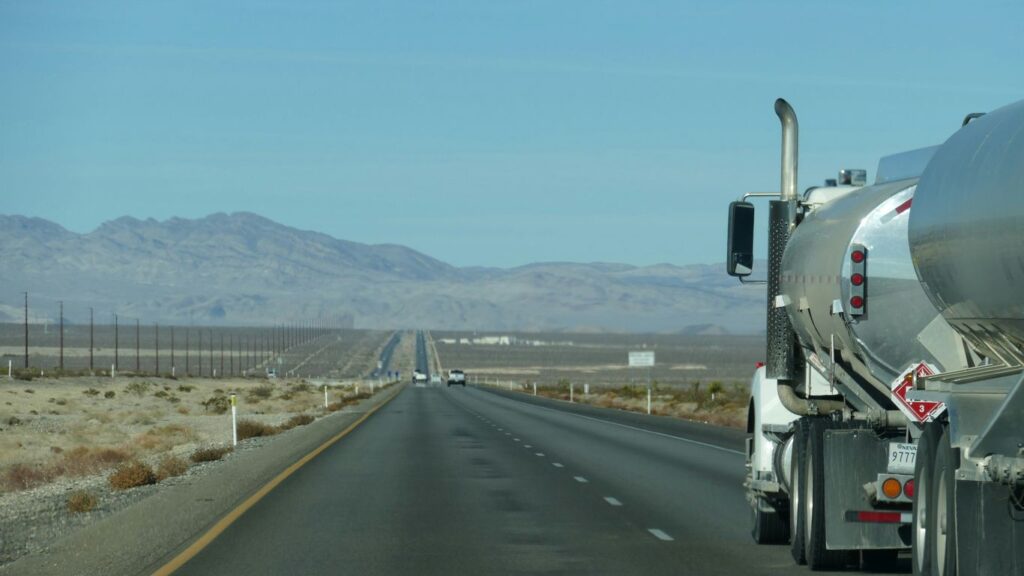 a semi truck driving down the highway