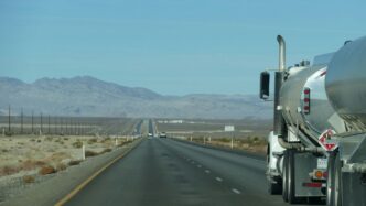 a semi truck driving down the highway