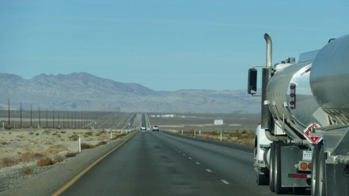 a semi truck driving down the highway