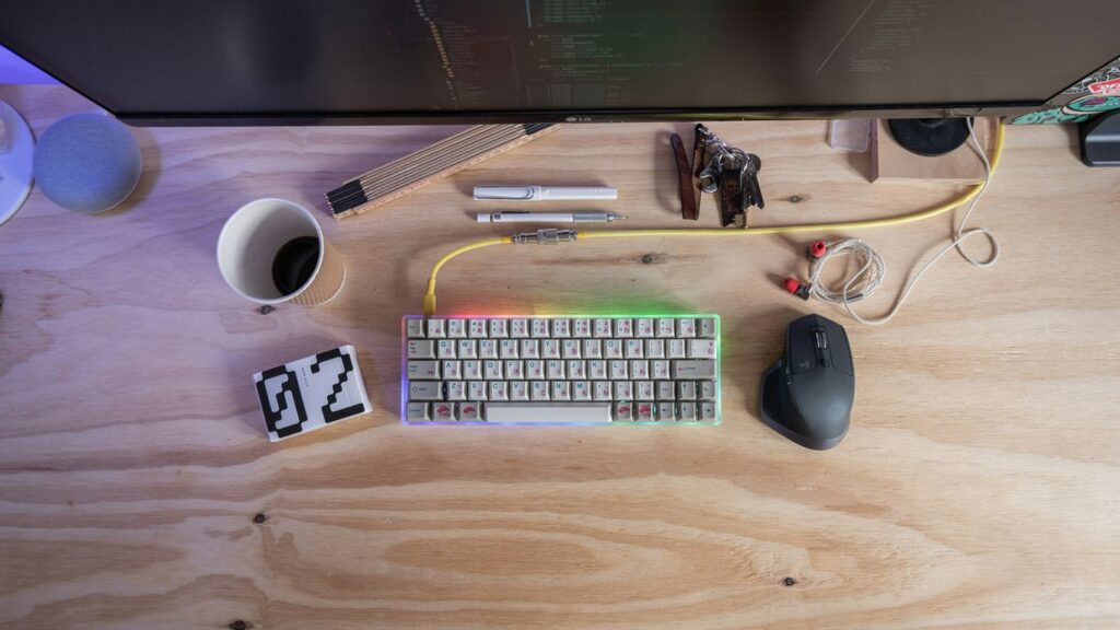 white computer keyboard beside mouse