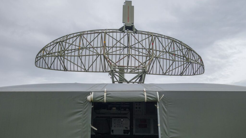 a satellite dish mounted on top of a military vehicle