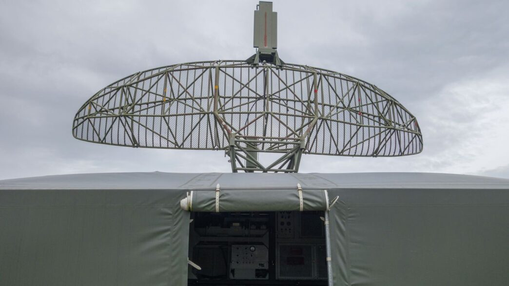 a satellite dish mounted on top of a military vehicle