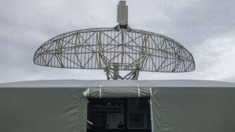 a satellite dish mounted on top of a military vehicle