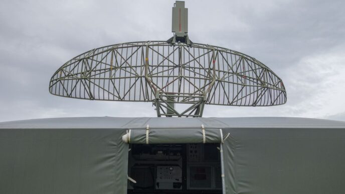 a satellite dish mounted on top of a military vehicle