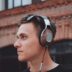 man using black and gray corded headphones
