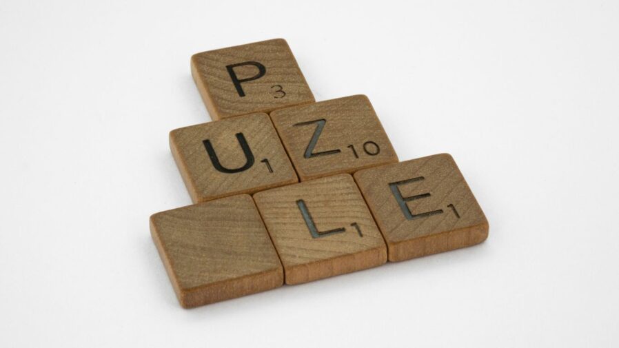 brown wooden number 2 on white surface