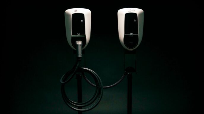 a couple of black and white phones on a black background