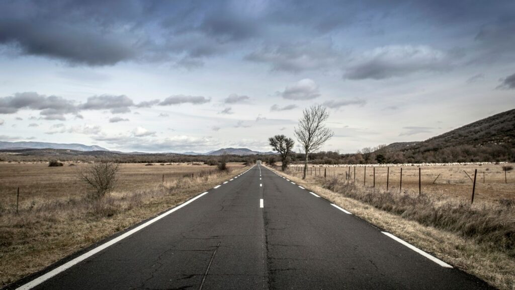 empty road between open field