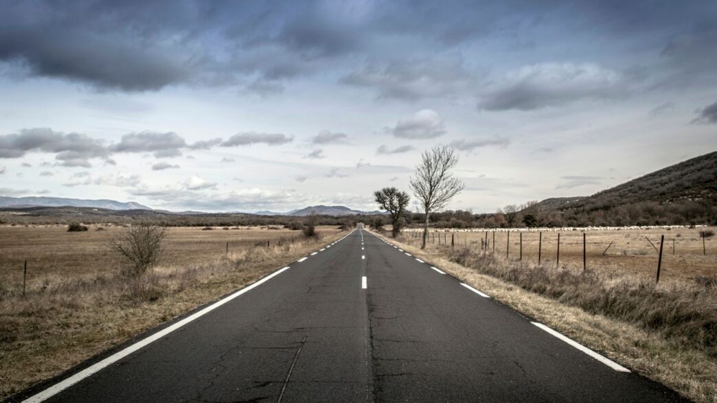 empty road between open field