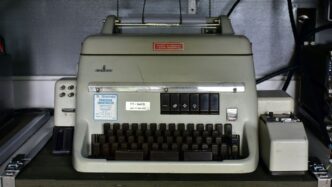 an old typewriter sitting on top of a table