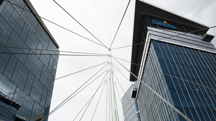 a view of two tall buildings from the ground