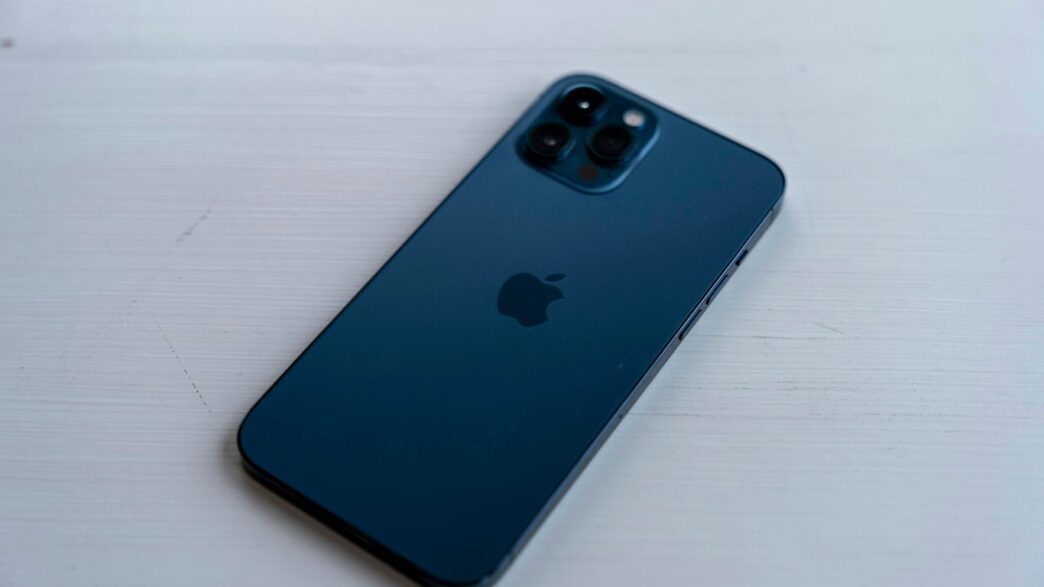 blue iphone case on white table