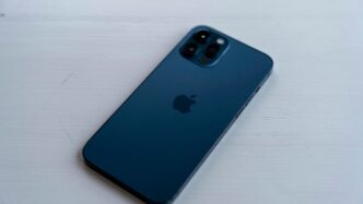 blue iphone case on white table