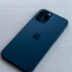 blue iphone case on white table