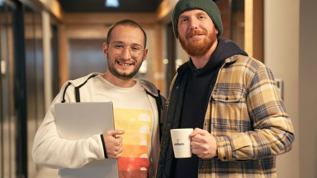 a couple of men standing next to each other
