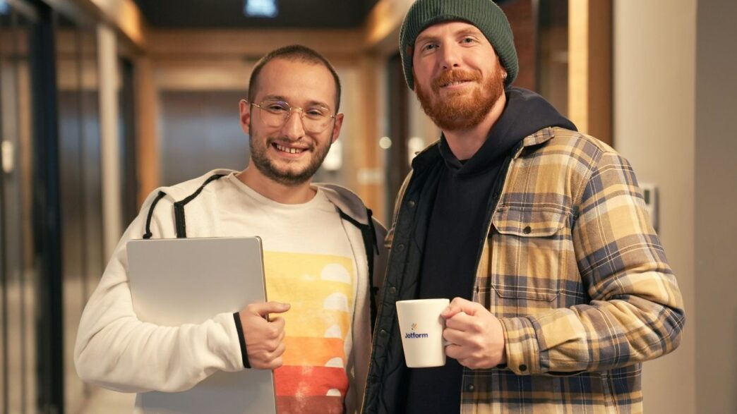 a couple of men standing next to each other