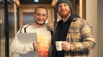 a couple of men standing next to each other
