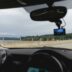 a person driving a car on a highway