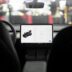 a car dashboard with a laptop on it