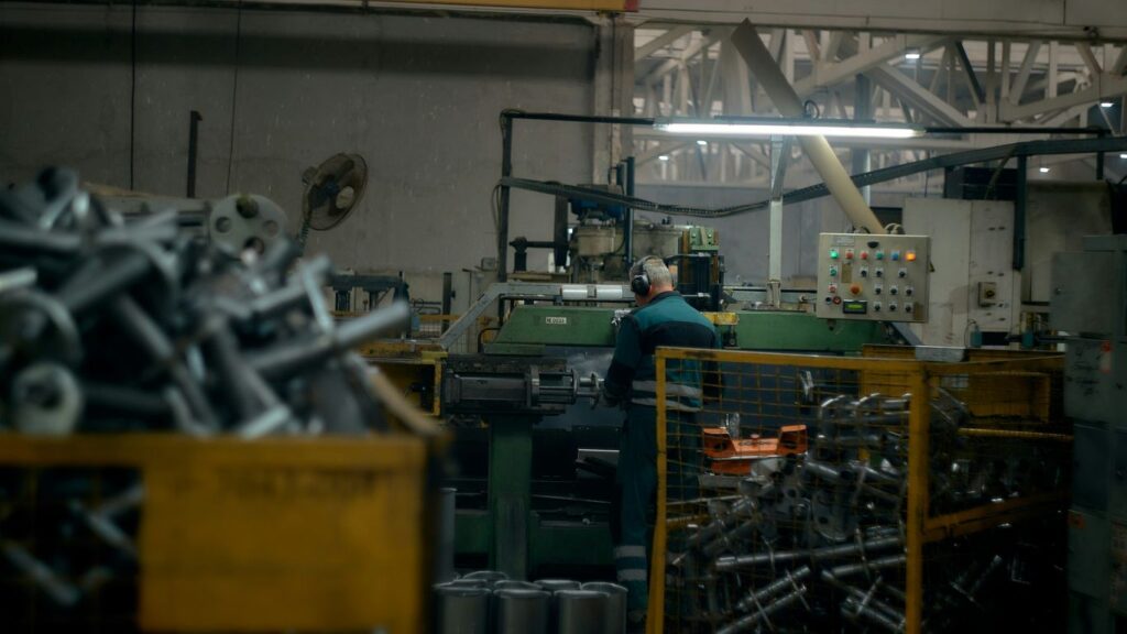 A man working on a machine in a factory