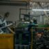 A man working on a machine in a factory