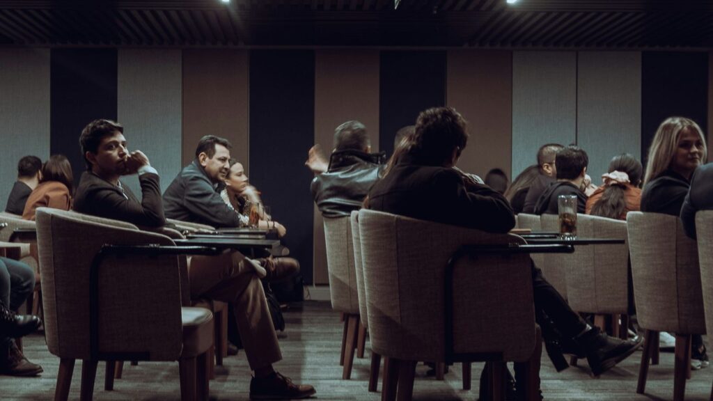 a group of people sitting at tables