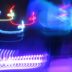 a blurry photo of a building with neon lights