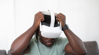a person holding a white bucket over the head