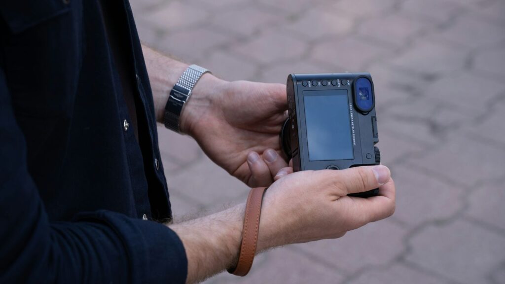 a man holding a cell phone in his hand