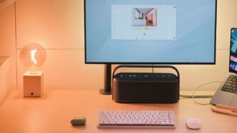 A desk with a laptop and a monitor on it