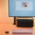 A desk with a laptop and a monitor on it