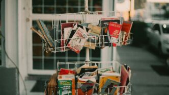 a shopping cart filled with lots of books