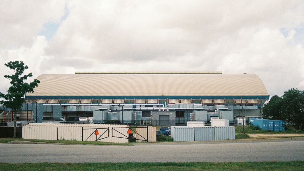 a large building with a gate in front of it