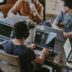 group of people using laptop computer