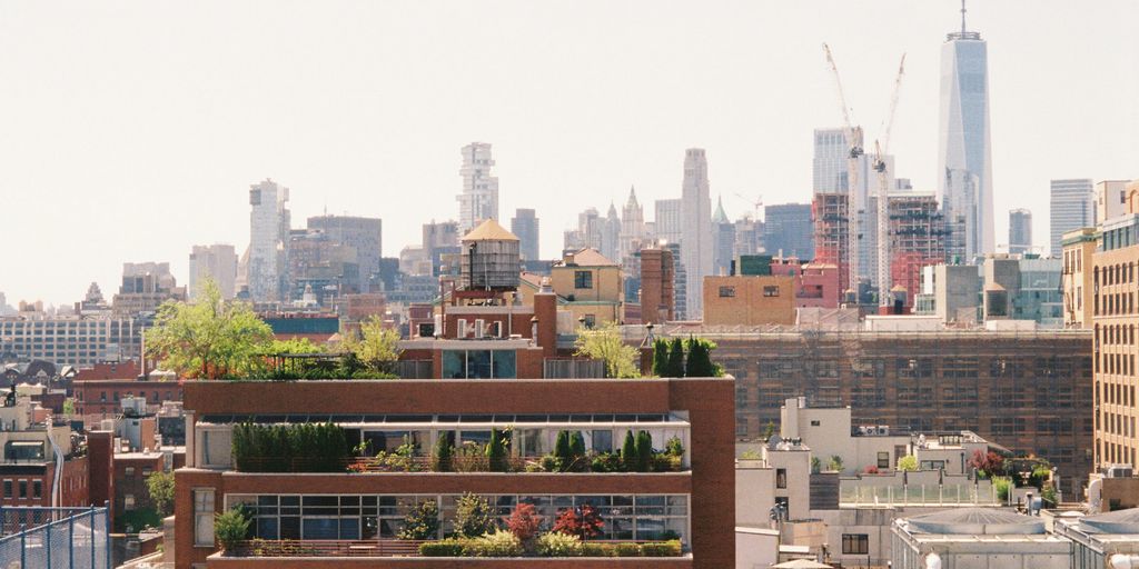 A new york city skyline view on a sunny day.