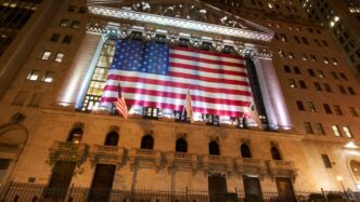 a large flag from the ceiling of a building