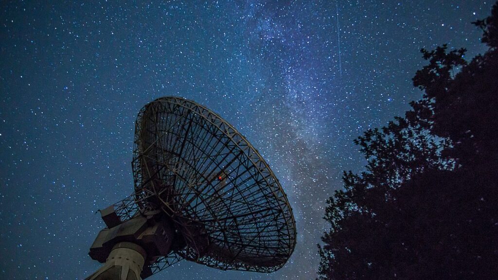 white satellite dish under blue sky during night time