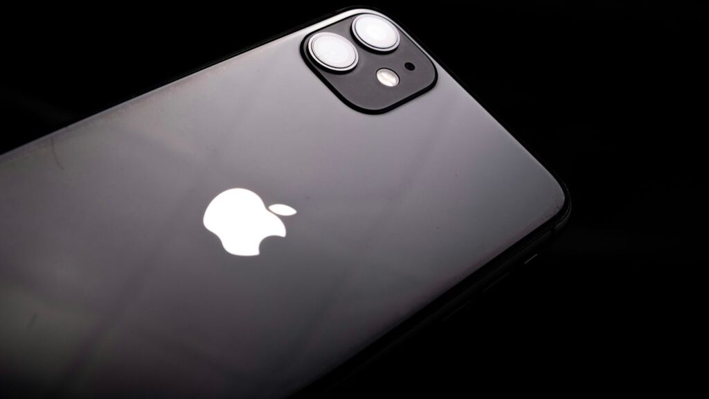 a close up of an iphone with a black background