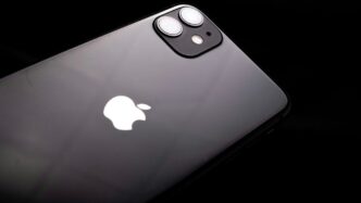 a close up of an iphone with a black background