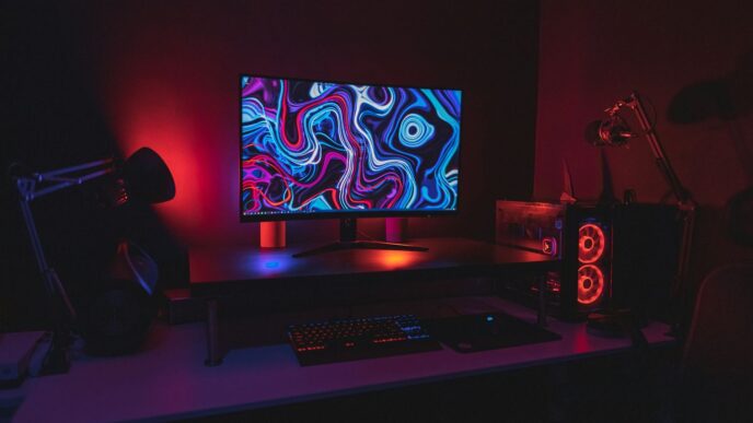 black flat screen computer monitor turned on near black computer keyboard