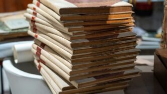 A stack of books sitting on top of a table