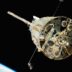 a satellite in orbit with the earth in the background