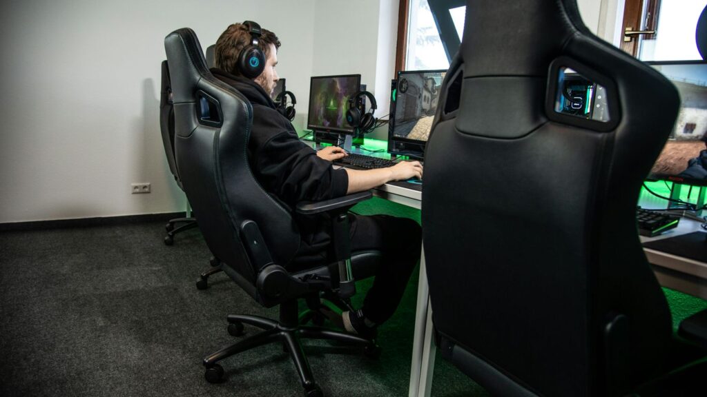 woman in black jacket sitting on black office rolling chair
